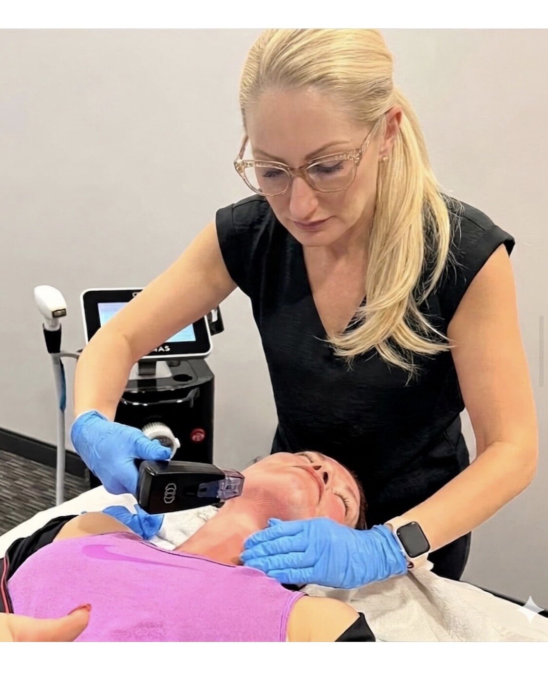Karrie Decker performing a facial treatment on a client